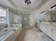 Spacious bathroom with separate tub, shower, and a long double vanity at 1320 Kildare Ct, Snellville, GA 30078