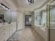 A spacious bathroom featuring double sinks, a soaking tub, and a separate shower at 1320 Kildare Ct, Snellville, GA 30078