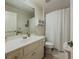 Bathroom with a large mirror, shower, toilet, and tiled floors at 1320 Kildare Ct, Snellville, GA 30078