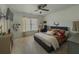 Comfortable bedroom with carpet flooring, a ceiling fan, and a TV at 1320 Kildare Ct, Snellville, GA 30078