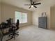 Bedroom with neutral paint, ceiling fan, and double door closet for ample storage at 1320 Kildare Ct, Snellville, GA 30078