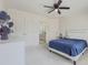Cozy bedroom with a white ceiling fan, carpet, and bathroom access at 1320 Kildare Ct, Snellville, GA 30078