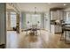 Inviting dining area with large windows, stylish lighting, and seamless flow to the kitchen area at 1320 Kildare Ct, Snellville, GA 30078