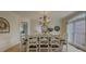 Dining room featuring hardwood floors, chandelier and view to another room at 1320 Kildare Ct, Snellville, GA 30078