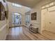 Well-lit foyer with hardwood floors and decoratively painted walls at 1320 Kildare Ct, Snellville, GA 30078