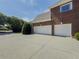 Exterior shot showing the three-car garage and long driveway at 1320 Kildare Ct, Snellville, GA 30078