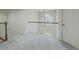 Hallway with white railing, a dark wood banister, and grey carpeting at 1320 Kildare Ct, Snellville, GA 30078