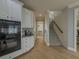 Kitchen with white cabinetry, black appliances, and hardwood floors at 1320 Kildare Ct, Snellville, GA 30078