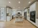 Well-appointed kitchen with white cabinetry, stainless steel appliances, and a spacious center island at 1320 Kildare Ct, Snellville, GA 30078