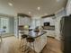 Modern kitchen with ample counter space, a center island, and plenty of storage in the white cabinets at 1320 Kildare Ct, Snellville, GA 30078