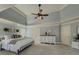 Inviting main bedroom with plush carpet, tray ceiling, and stylish decor at 1320 Kildare Ct, Snellville, GA 30078