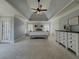 Spacious main bedroom with plush carpet, an elegant ceiling, and natural light at 1320 Kildare Ct, Snellville, GA 30078