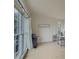 Home office with large windows, hardwood floors, desk, and office supplies at 1320 Kildare Ct, Snellville, GA 30078
