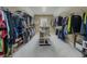 A large walk-in closet with custom shelving, providing ample storage space at 1320 Kildare Ct, Snellville, GA 30078