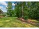Lush backyard with mature trees at 1376 Woodbine St, Marietta, GA 30062