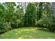 Private backyard with a lush green lawn, perfect for relaxation and outdoor activities at 1376 Woodbine St, Marietta, GA 30062