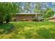 Expansive backyard with mature trees and green lawn, providing a private, tranquil outdoor space at 1376 Woodbine St, Marietta, GA 30062