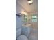 Bright bathroom featuring a shower-tub combination, tile floors, and a vanity at 1376 Woodbine St, Marietta, GA 30062