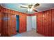 Spacious bedroom with wood paneling, multiple closets, and bright, natural light at 1376 Woodbine St, Marietta, GA 30062