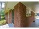 Detail of a brick carport featuring convenient access and durable construction at 1376 Woodbine St, Marietta, GA 30062