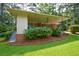 Charming single-story home featuring a covered porch, brick facade and lush landscaping at 1376 Woodbine St, Marietta, GA 30062