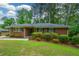 Well-kept brick home featuring neat landscaping and dark shutters, presenting a welcoming curb appeal at 1376 Woodbine St, Marietta, GA 30062