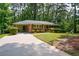 Quaint brick home with a carport and manicured landscaping, offering a blend of charm and functionality at 1376 Woodbine St, Marietta, GA 30062