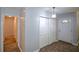 Well-lit hallway with a front door, closet, and doorway leading to other rooms at 1376 Woodbine St, Marietta, GA 30062