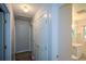 Hallway with storage closet and adjacent bathroom including vanity, toilet and shower at 1376 Woodbine St, Marietta, GA 30062