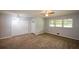 View of a living room with carpet, neutral paint, closet and a large window for natural light at 1376 Woodbine St, Marietta, GA 30062