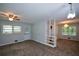 Open living room featuring neutral walls, carpet flooring, and natural light, perfect for relaxation at 1376 Woodbine St, Marietta, GA 30062