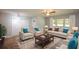 Bright and airy living room with neutral furniture, hardwood floors, and natural light from large windows at 1376 Woodbine St, Marietta, GA 30062