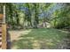 Expansive, shady backyard offers an abundance of foliage, and lush ground covering creating a private retreat at 2537 Baker Nw Rd, Atlanta, GA 30318