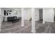 Spacious finished basement with luxury vinyl plank flooring and minimalist furniture at 2537 Baker Nw Rd, Atlanta, GA 30318