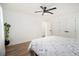 Light filled bedroom with modern ceiling fan, crisp white walls, and two large closets at 2537 Baker Nw Rd, Atlanta, GA 30318