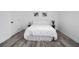 Cozy bedroom with neutral decor, and hardwood flooring throughout at 2537 Baker Nw Rd, Atlanta, GA 30318