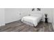 Comfortable bedroom with white walls, a queen bed, and stylish decor at 2537 Baker Nw Rd, Atlanta, GA 30318