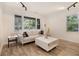 Cozy living room with large windows, hardwood floors, neutral colors, and track lighting offering a comfortable setting at 2537 Baker Nw Rd, Atlanta, GA 30318