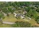 A beautiful aerial view of a home and its surrounding community, complete with lush greenery and a swimming pool at 2545 Hickory Level Rd, Villa Rica, GA 30180