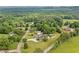 A beautiful aerial view of a home and its surrounding community, complete with lush greenery and a swimming pool at 2545 Hickory Level Rd, Villa Rica, GA 30180