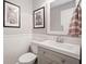 Stylish half-bath features beadboard walls, framed art, and modern fixtures at 2545 Hickory Level Rd, Villa Rica, GA 30180