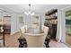 Dining room with a large table, six chairs, bar and sliding glass doors to outdoor patio at 2545 Hickory Level Rd, Villa Rica, GA 30180