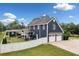 Charming two-story home featuring a two-car garage, manicured lawn, privacy fence and lush landscaping at 2545 Hickory Level Rd, Villa Rica, GA 30180