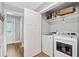 Convenient laundry room with modern appliances and ample storage space at 2545 Hickory Level Rd, Villa Rica, GA 30180