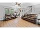 Spacious living room with hardwood floors, ceiling fan, and plenty of natural light at 2545 Hickory Level Rd, Villa Rica, GA 30180