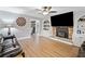 Bright and spacious living room with hardwood floors and a cozy fireplace at 2545 Hickory Level Rd, Villa Rica, GA 30180