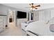 Spacious main bedroom with an ensuite bathroom, a ceiling fan, and two windows for natural light at 2545 Hickory Level Rd, Villa Rica, GA 30180
