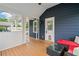 Cozy covered patio with outdoor seating and a view of the manicured backyard at 2545 Hickory Level Rd, Villa Rica, GA 30180