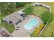 Inviting backyard pool with a seating area, lush greenery, and privacy fence perfect for outdoor enjoyment at 2545 Hickory Level Rd, Villa Rica, GA 30180