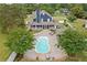 Gorgeous backyard featuring an inviting pool, a charming house, and a beautifully landscaped yard at 2545 Hickory Level Rd, Villa Rica, GA 30180